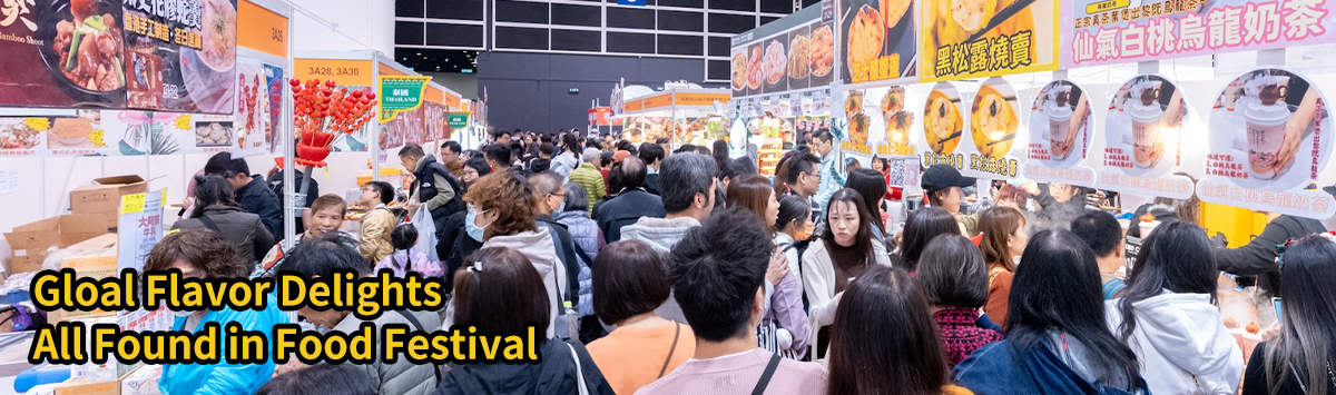 A crowded food festival with numerous stalls displaying dried fruits, seafood, and festive culinary offerings, filled with people shopping and sampling various treats.